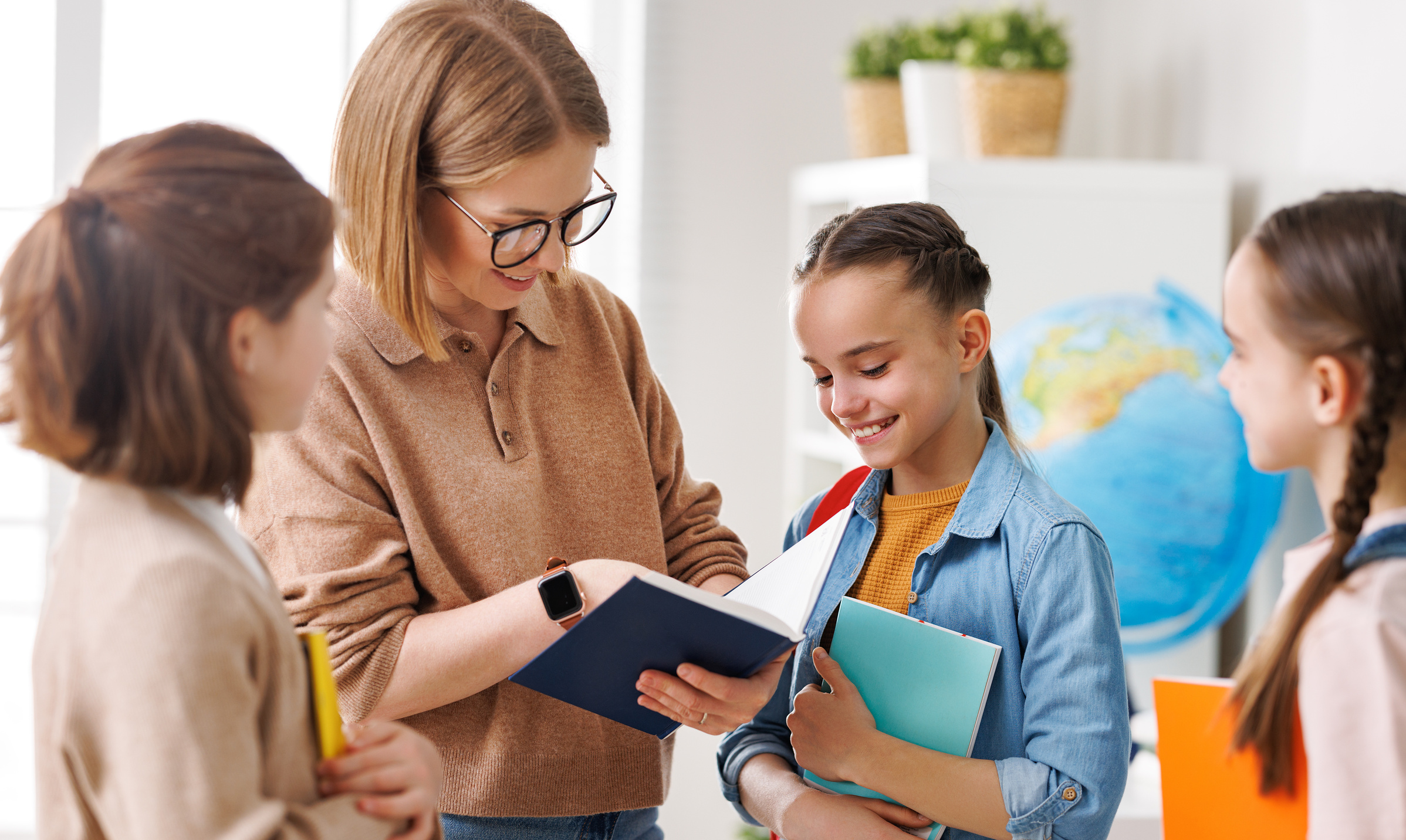 Teacher speaking with students during lesson